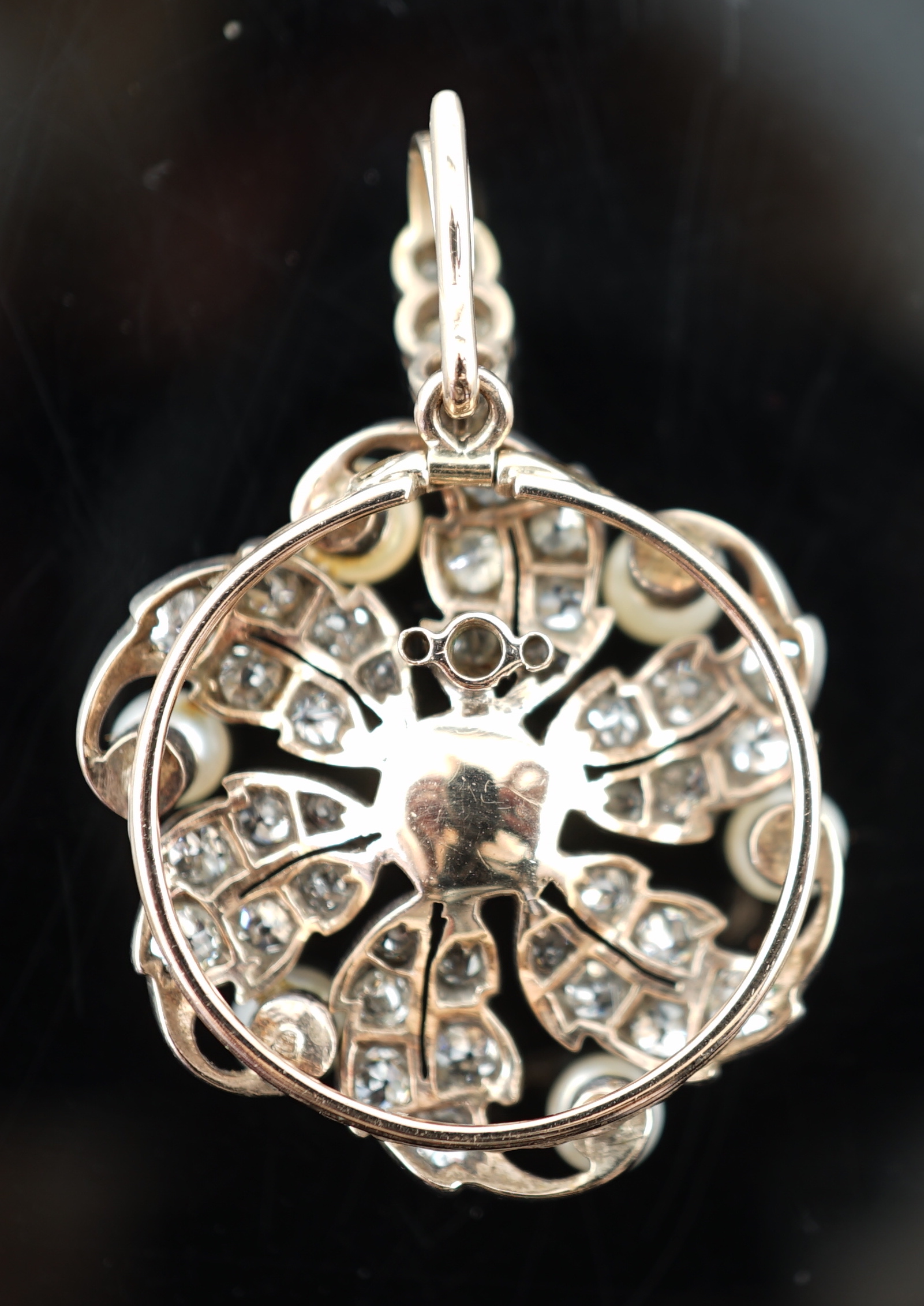 A Victorian gold, button pearl and diamond cluster set pendant, with three stone diamond set bale